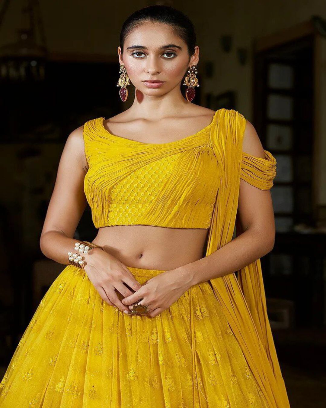 Citrine Yellow Sequins Embroidered Net Party Wear Lehenga